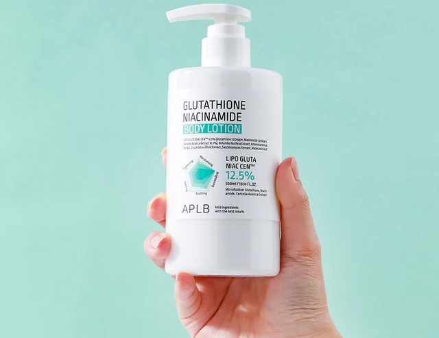 Body lotion pump bottle held in hand